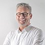 Testimonial section with client portraits